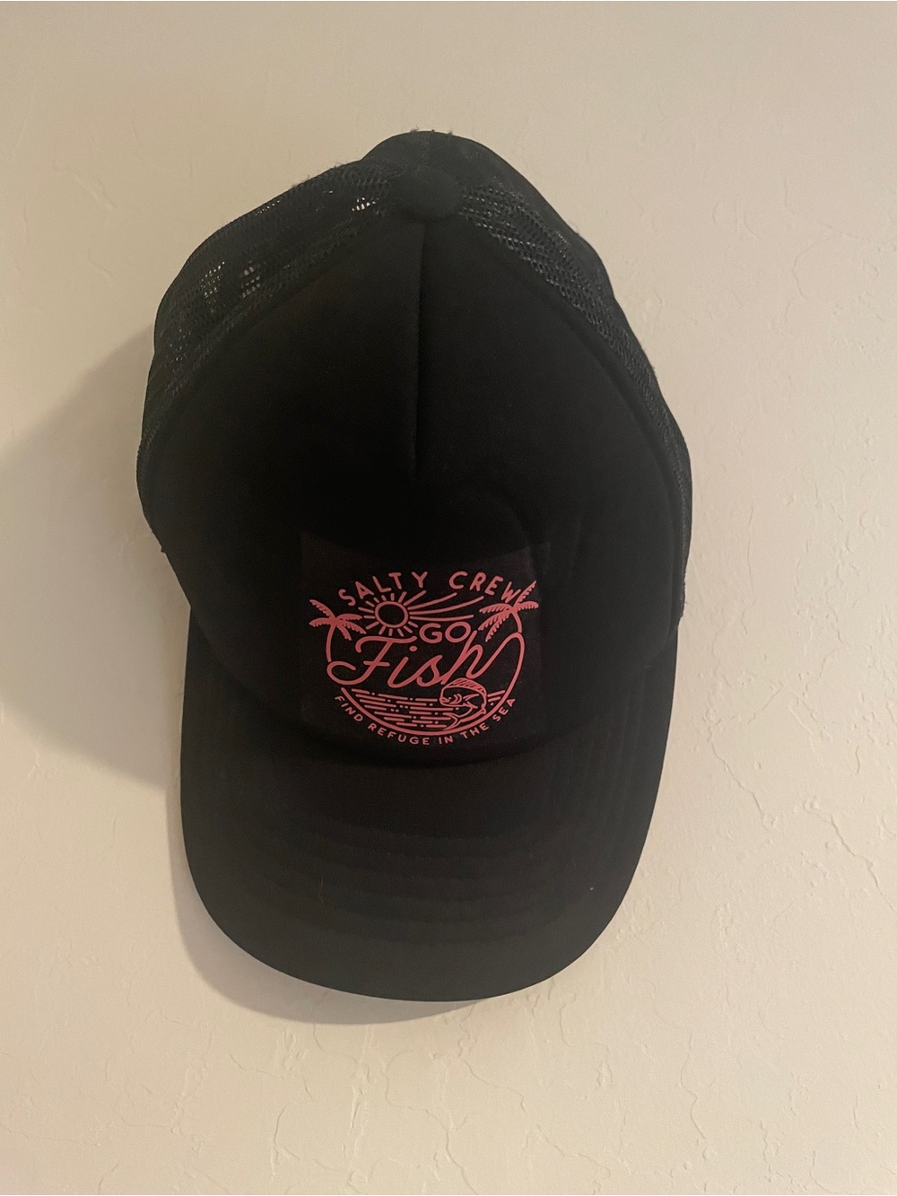 Salty Crew Black Trucker Hat with Pink 'Go Fish' Patch